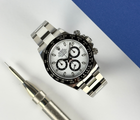 Rolex Daytona 116500LN stående frontvisning med hvid skive i mint stand komplet sæt.