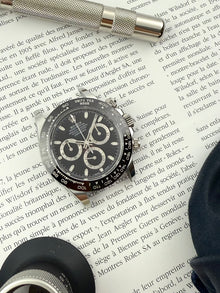 Rolex Daytona 116500LN med sort skive i mint stand komplet sæt.